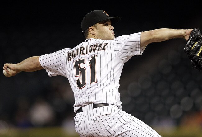 HOUSTON - SEPTEMBER 26:  Pitcher Wandy Rodriguez #51 of the Houston Astros throws against the St. Louis Cardinals at Minute Maid Park on September 26, 2011 in Houston, Texas.  (Photo by Bob Levey/Getty Images)
