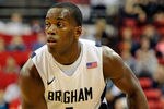 LAS VEGAS, NV - MARCH 11:  Charles Abouo #1 of the Brigham Young University Cougars looks to pass during a semifinal game of the Conoco Mountain West Conference Basketball tournament against the New Mexico Lobos at the Thomas & Mack Center March 11, 2011 in Las Vegas, Nevada. BYU won 87-76.  (Photo by Ethan Miller/Getty Images)