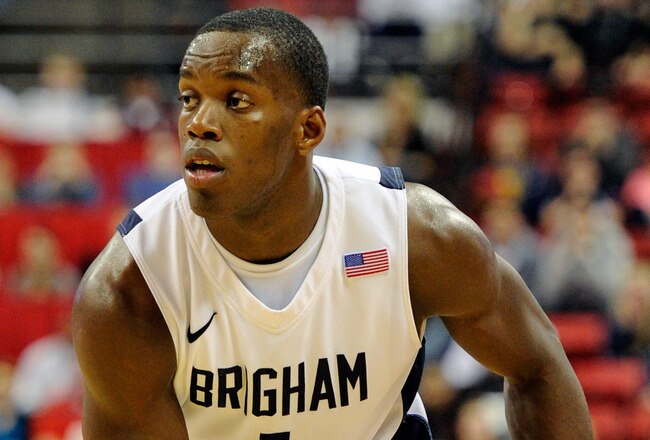 LAS VEGAS, NV - MARCH 11:  Charles Abouo #1 of the Brigham Young University Cougars looks to pass during a semifinal game of the Conoco Mountain West Conference Basketball tournament against the New Mexico Lobos at the Thomas & Mack Center March 11, 2011 in Las Vegas, Nevada. BYU won 87-76.  (Photo by Ethan Miller/Getty Images)