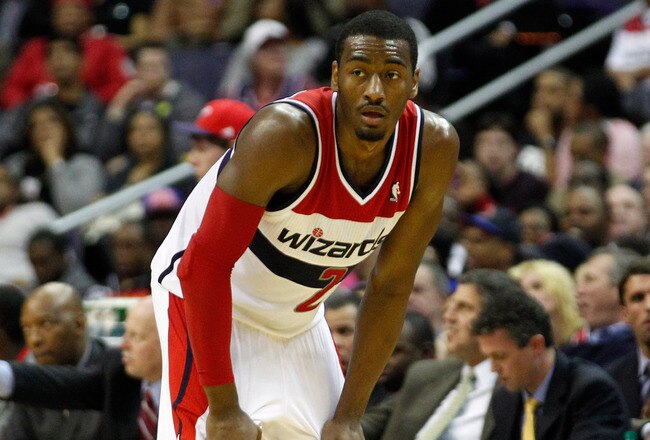 WASHINGTON, DC - JANUARY 06:  John Wall #2 of the Washington Wizards looks on against the New York Knicks during the second half at Verizon Center on January 6, 2012 in Washington, DC.  NOTE TO USER: User expressly acknowledges and agrees that, by downloading and or using this photograph, User is consenting to the terms and conditions of the Getty Images License Agreement.  (Photo by Rob Carr/Getty Images)