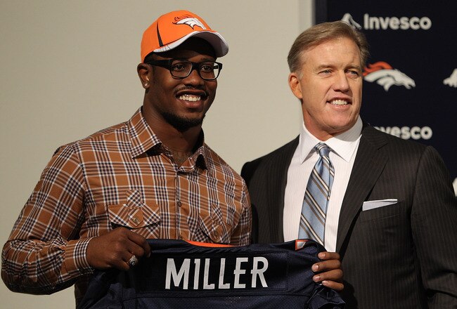 ENGLEWOOD, CO - APRIL 29:  Von Miller of the Denver Broncos is presented to the media for the first time with vice president of football operations John Elway at Dove Valley on April 29, 2011 in Englewood, Colorado. Miller, a projected outside linebacker in head coach John Fox's new 4-3 scheme, was selected second overall from Texas A&M. (Photo by Justin Edmonds/Getty Images)