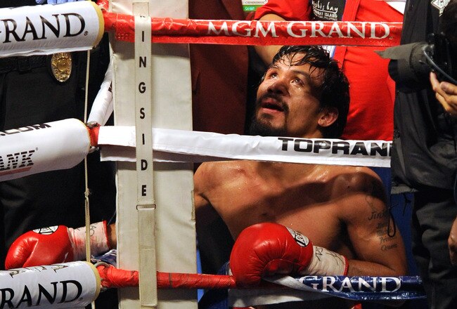 LAS VEGAS, NV - NOVEMBER 12:  Boxer Manny Pacquiao prays in the corner of the ring after his WBO world welterweight title fight against Juan Manuel Marquez at the MGM Grand Garden Arena November 12, 2011 in Las Vegas, Nevada. Pacquiao retained his title with a majority decision victory.  (Photo by Ethan Miller/Getty Images)