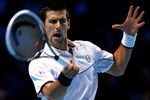 LONDON, ENGLAND - NOVEMBER 25:  Novak Djokovic of Serbia hits a forehand during the men's singles match against Janko Tipsarevic of Serbia during the Barclays ATP World Tour Finals at the O2 Arena on November 25, 2011 in London, England.  (Photo by Clive Brunskill/Getty Images)