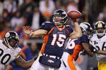 DENVER, CO - JANUARY 08:  Tim Tebow #15 of the Denver Broncos looks to pass against the Pittsburgh Steelers during the AFC Wild Card Playoff game at Sports Authority Field at Mile High on January 8, 2012 in Denver, Colorado.  (Photo by Jeff Gross/Getty Images)