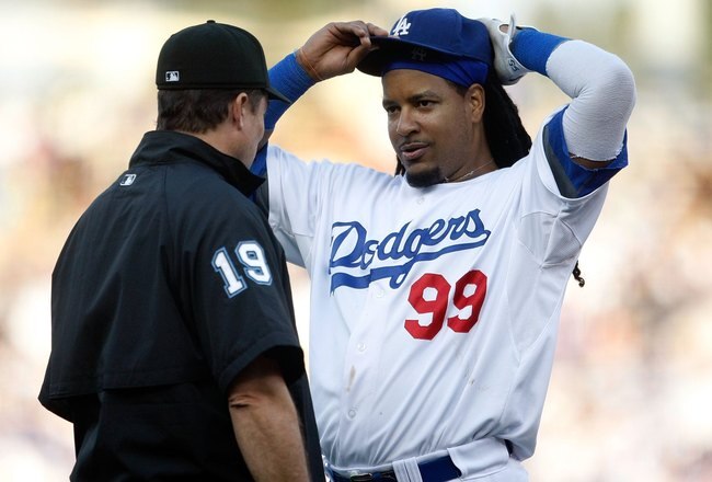 LOS ANGELES, CA - OCTOBER 08:  Manny Ramirez #99 of the Los Angeles Dodgers talks with an umpire against the St. Louis Cardinals in Game Two of the NLDS during the 2009 MLB Playoffs at Dodger Stadium on October 8, 2009 in Los Angeles, California.  (Photo by Jeff Gross/Getty Images)