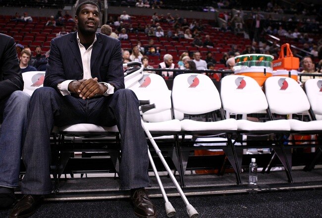 PORTLAND, OR - OCTOBER 10:  Greg Oden #52 of the Portland Trail Blazers, who is out for the season after under going micro fracture surgery in his knee, sits on the bench to watch a pre-season game against the Los Angeles Clippers at the Rose Garden on October 10, 2007 in Portland, Oregon.  NOTE TO USER: User expressly acknowledges and agrees that, by downloading and or using this Photograph, user is consenting to the terms and conditions of the Getty Images License Agreement.  (Photo by Jonathan Ferrey/Getty Images)