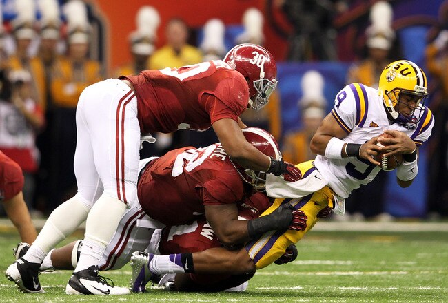 NEW ORLEANS, LA - JANUARY 09:  Jordan Jefferson #9 of the Louisiana State University Tigers is sacked late in the second quarter by the Alabama Crimson Tide during the 2012 Allstate BCS National Championship Game at Mercedes-Benz Superdome on January 9, 2012 in New Orleans, Louisiana.  (Photo by Andy Lyons/Getty Images)