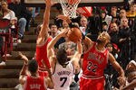 SACRAMENTO, CA - DECEMBER 29:  Jimmer Fredette #7 of the Sacramento Kings has a shot blocked by Taj Gibson #22 of the Chicago Bulls at Power Balance Pavilion on December 29, 2011 in Sacramento, California. NOTE TO USER: User expressly acknowledges and agrees that, by downloading and or using this photograph, User is consenting to the terms and conditions of the Getty Images License Agreement.  (Photo by Ezra Shaw/Getty Images)