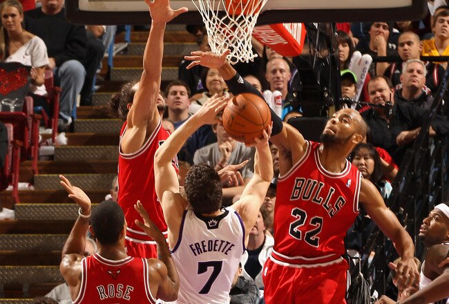 SACRAMENTO, CA - DECEMBER 29:  Jimmer Fredette #7 of the Sacramento Kings has a shot blocked by Taj Gibson #22 of the Chicago Bulls at Power Balance Pavilion on December 29, 2011 in Sacramento, California. NOTE TO USER: User expressly acknowledges and agrees that, by downloading and or using this photograph, User is consenting to the terms and conditions of the Getty Images License Agreement.  (Photo by Ezra Shaw/Getty Images)