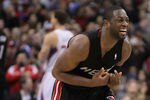 LOS ANGELES, CA - JANUARY 11:  Dwyane Wade #3 of the Miami Heat reacts after teammate LeBron James (not pictured) wasn't able to make a shot before being fouled in the fourth quarter against the Los Angeles Clippers at Staples Center on January 11, 2012 in Los Angeles, California. The Clippers defeated the Heat 95-89 in overtime.  (Photo by Jeff Gross/Getty Images)