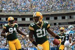CHARLOTTE, NC - SEPTEMBER 18:   Charles Woodson #21 of the Green Bay Packers celebrates after recovering a fumble against the Carolina Panthers during their game at Bank of America Stadium on September 18, 2011 in Charlotte, North Carolina.  (Photo by Streeter Lecka/Getty Images)