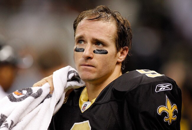 NEW ORLEANS, LA - DECEMBER 26:  Quarterback Drew Brees #9 of the New Orleans Saints looks on against the Atlanta Falcons in the second quarter at the Mercedes-Benz Superdome on December 26, 2011 in New Orleans, Louisiana.  (Photo by Chris Graythen/Getty Images)