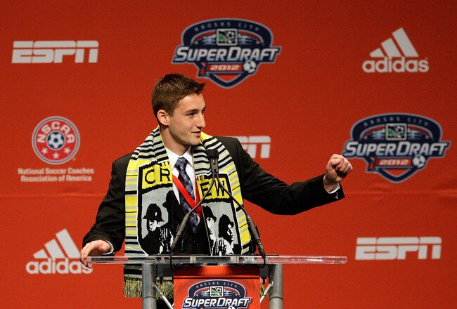 KANSAS CITY, MO - JANUARY 12:  Number 10 overall pick, Ethan Finlay, selected by the Columbus Crew, motions to his family during the first round of the 2012 MLS SuperDraft presented by Adidas on January 12, 2012 at Kansas City Convention Center in Kansas City, Missouri.  (Photo by Jamie Squire/Getty Images)