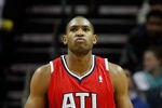 CHARLOTTE, NC - JANUARY 06:  Al Horford #15 of the Atlanta Hawks reacts to making a shot against the Charlotte Bobcats during their game at Time Warner Cable Arena on January 6, 2012 in Charlotte, North Carolina.  NOTE TO USER: User expressly acknowledges and agrees that, by downloading and or using this photograph, User is consenting to the terms and conditions of the Getty Images License Agreement.  (Photo by Streeter Lecka/Getty Images)