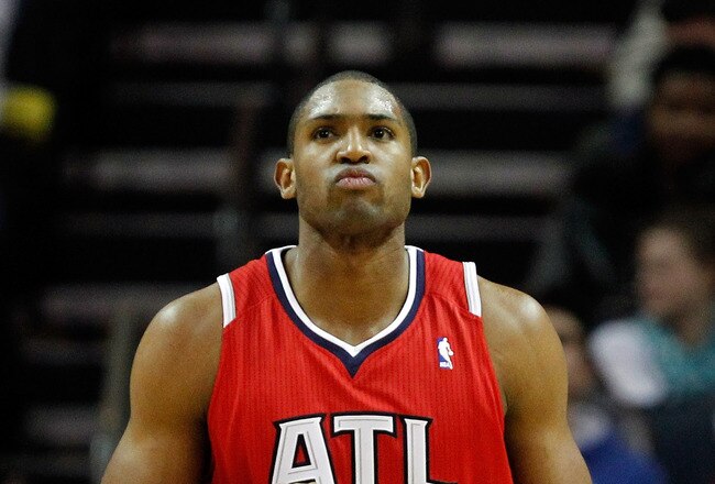 CHARLOTTE, NC - JANUARY 06:  Al Horford #15 of the Atlanta Hawks reacts to making a shot against the Charlotte Bobcats during their game at Time Warner Cable Arena on January 6, 2012 in Charlotte, North Carolina.  NOTE TO USER: User expressly acknowledges and agrees that, by downloading and or using this photograph, User is consenting to the terms and conditions of the Getty Images License Agreement.  (Photo by Streeter Lecka/Getty Images)