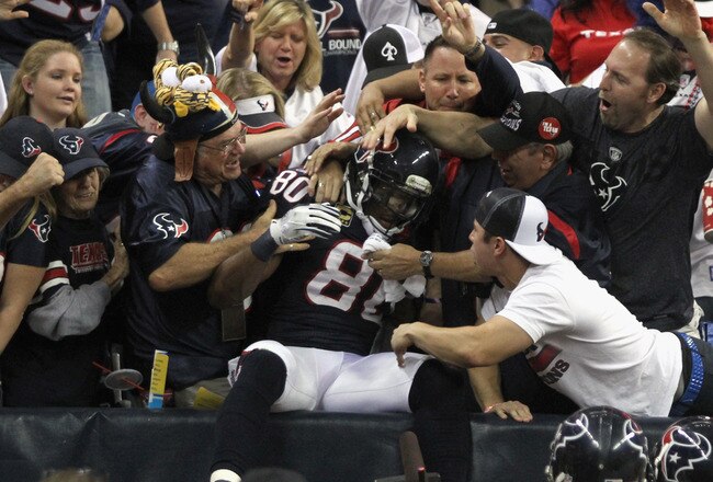 HOUSTON, TX - JANUARY 07:  Andre Johnson #80 of the Houston Texans celebrates with fans after he scored a 40-yard touchdown reception in the third quarter against the Cincinnati Bengals during their 2012 AFC Wild Card Playoff game at Reliant Stadium on January 7, 2012 in Houston, Texas.  (Photo by Thomas B. Shea/Getty Images)