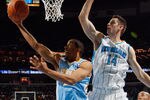 NEW ORLEANS, LA - JANUARY 06:  Andre Miller #24 of the Denver Nuggets shoots the ball over Jason Smith #14 of the New Orleans Hornets at New Orleans Arena on January 6, 2012 in New Orleans, Louisiana.  NOTE TO USER: User expressly acknowledges and agrees that, by downloading and or using this photograph, User is consenting to the terms and conditions of the Getty Images License Agreement.  (Photo by Chris Graythen/Getty Images)