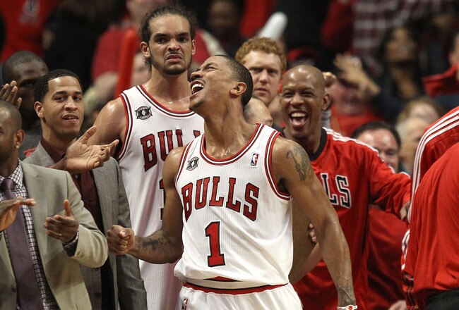 CHICAGO, IL - MAY 15:  (L-R) Kurt Thomas #40, John Lucas III, Joakim Noah #13, Derrick Rose #1 and Keith Bogans #6 of the Chicago Bulls celebrate late in the fourth quarter against the Miami Heat in Game One of the Eastern Conference Finals during the 2011 NBA Playoffs on May 15, 2011 at the United Center in Chicago, Illinois. The Bulls won 103-82. NOTE TO USER: User expressly acknowledges and agrees that, by downloading and or using this photograph, User is consenting to the terms and conditions of the Getty Images License Agreement  (Photo by Jonathan Daniel/Getty Images)