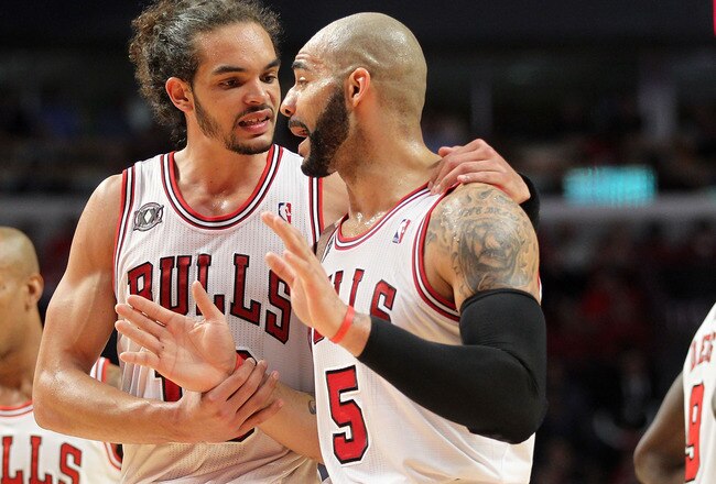 CHICAGO, IL - MAY 26:  Joakim Noah #13 and Carlos Boozer #5 of the Chicago Bulls talk on court against the Miami Heat in Game Five of the Eastern Conference Finals during the 2011 NBA Playoffs on May 26, 2011 at the United Center in Chicago, Illinois. The Heat won 83-80. NOTE TO USER: User expressly acknowledges and agrees that, by downloading and or using this photograph, User is consenting to the terms and conditions of the Getty Images License Agreement.  (Photo by Mike Ehrmann/Getty Images)