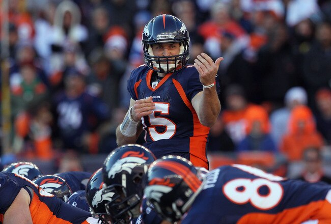 DENVER, CO - JANUARY 08:  Quarterback Tim Tebow #15 of the Denver Broncos motions to a receiver during the AFC Wild Card Playoff game at Sports Authority Field against the Pittsburgh Steelers at Mile High on January 8, 2012 in Denver, Colorado. The Broncos defeated the Steelers in overtime 23-29.  (Photo by Jeff Gross/Getty Images)