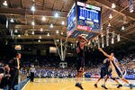 DURHAM, NC - JANUARY 12:  Coach Tony Bennett watches as Mike Scott #23 of the Virginia Cavaliers shoots a three-point shot against the Duke Blue Devils during play at Cameron Indoor Stadium on January 12, 2012 in Durham, North Carolina. Duke won 61-58.  (Photo by Grant Halverson/Getty Images)