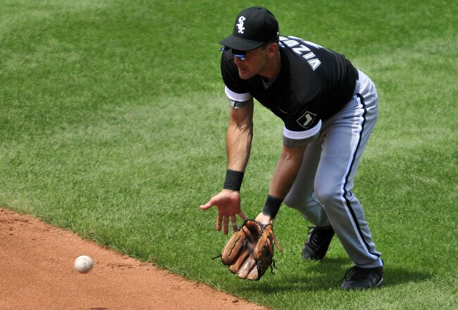 CLEVELAND, OH - JULY 24: Second baseman Omar Vizquel #11 of the Chicago White Sox fields a ground ball from Travis Hafner #48 (not shown) of the Cleveland Indians during the third inning at Progressive Field on July 24, 2011 in Cleveland, Ohio. (Photo by Jason Miller/Getty Images)