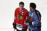RALEIGH, NC - JANUARY 29:  Jonathan Toews #19 of the Chicago Blackhawks talks with Dustin Byfuglien #33 of the Atlanta Thrashers before the Honda NHL SuperSkills competition part of 2011 NHL All-Star Weekend at the RBC Center on January 29, 2011 in Raleigh, North Carolina.  (Photo by Bruce Bennett/Getty Images)