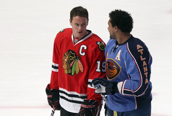 RALEIGH, NC - JANUARY 29:  Jonathan Toews #19 of the Chicago Blackhawks talks with Dustin Byfuglien #33 of the Atlanta Thrashers before the Honda NHL SuperSkills competition part of 2011 NHL All-Star Weekend at the RBC Center on January 29, 2011 in Raleigh, North Carolina.  (Photo by Bruce Bennett/Getty Images)