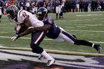 BALTIMORE, MD - OCTOBER 16: Wide receiver  Jacoby Jones #12 of the Houston Texans catches a touchdown pass in front of defender Ed Reed #20 of the Baltimore Ravens during the second half at M&T Bank Stadium on October 16, 2011 in Baltimore, Maryland.  (Photo by Rob Carr/Getty Images)