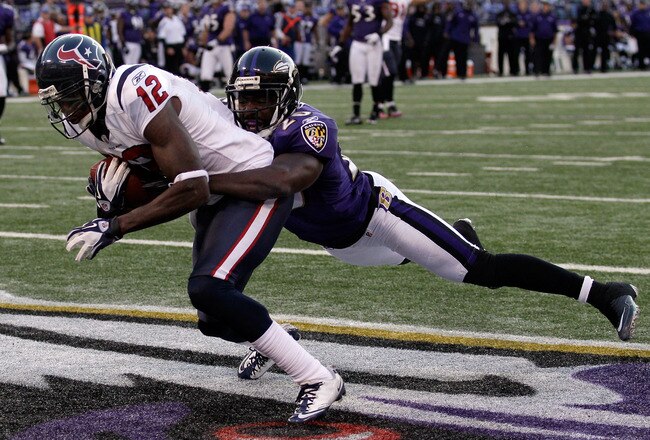 BALTIMORE, MD - OCTOBER 16: Wide receiver  Jacoby Jones #12 of the Houston Texans catches a touchdown pass in front of defender Ed Reed #20 of the Baltimore Ravens during the second half at M&T Bank Stadium on October 16, 2011 in Baltimore, Maryland.  (Photo by Rob Carr/Getty Images)
