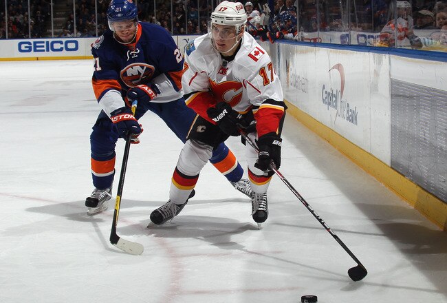 UNIONDALE, NY - DECEMBER 29:  Rene Bourque #17 of the Calgary Flames skates against the New York Islanders at the Nassau Veterans Memorial Coliseum on December 29, 2011 in Uniondale, New York. The Islanders defeated the Flames 3-1.  (Photo by Bruce Bennett/Getty Images)