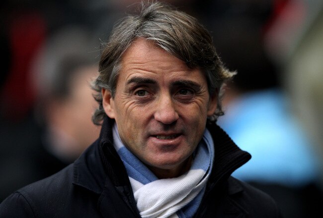 MANCHESTER, ENGLAND - JANUARY 08:  Manchester City Manager Roberto Mancini looks on prior to the FA Cup Third Round match between Manchester City and Manchester United at the Etihad Stadium on January 8, 2012 in Manchester, England. (Photo by Alex Livesey/Getty Images)