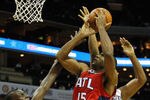 CHARLOTTE, NC - JANUARY 06:  Bismack Biyombo #0 of the Charlotte Bobcats tries to stop Al Horford #15 of the Atlanta Hawks during their game at Time Warner Cable Arena on January 6, 2012 in Charlotte, North Carolina.  NOTE TO USER: User expressly acknowledges and agrees that, by downloading and or using this photograph, User is consenting to the terms and conditions of the Getty Images License Agreement.  (Photo by Streeter Lecka/Getty Images)