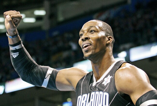 OKLAHOMA CITY, OK - DECEMBER 25:  Dwight Howard #12 of the Orlando Magic looks to have a foul called during the NBA season opening game against the Oklahoma City Thunder December 25, 2011 at the Chesapeake Energy Arena in Oklahoma City, Oklahoma.  Oklahoma City defeated Orlando 97-89. NOTE TO USER: User expressly acknowledges and agrees that, by downloading and or using this Photograph, user is consenting to the terms and conditions of the Getty Images License Agreement.  (Photo by Brett Deering/Getty Images)
