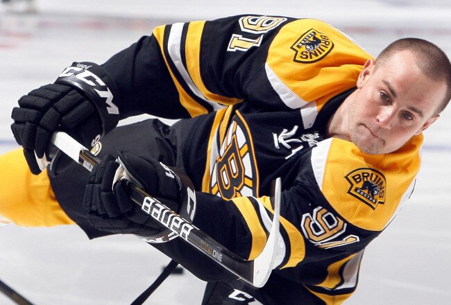 TORONTO, CANADA - DECEMBER 4: Marc Savard #91 of the Boston Bruins shoots before game action against the Toronto Maple Leafs at the Air Canada Centre December 4, 2010 in Toronto, Ontario, Canada. (Photo by Abelimages / Getty Images)