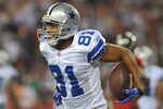 TAMPA, FL - DECEMBER 17:  Wide receiver Laurent Robinson #81 of the Dallas Cowboys celebrates after a touchdown catch against the Tampa Bay Buccaneers December 17, 2011 at Raymond James Stadium in Tampa, Florida. (Photo by Al Messerschmidt/Getty Images)