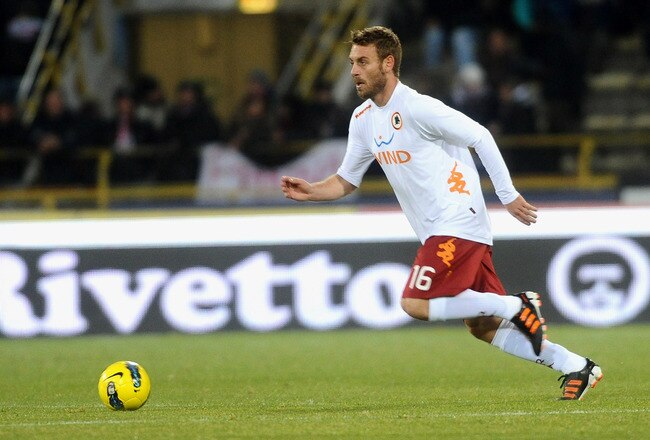 BOLOGNA, ITALY - DECEMBER 21:  Daniele De Rossi # 16 of AS Roma in action during the Serie A match between Bologna FC and AS Roma at Stadio Renato Dall'Ara on December 21, 2011 in Bologna, Italy.  (Photo by Mario Carlini / Iguana Press/Getty Images)