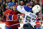 MONTREAL, CANADA - JANUARY 10:  Mike Cammalleri #13 of the Montreal Canadiens and David Perron #57 of the St. Louis Blues mix it up during the NHL game at the Bell Centre on January 10, 2012 in Montreal, Quebec, Canada.  (Photo by Richard Wolowicz/Getty Images)