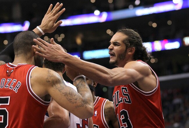 LOS ANGELES, CA - DECEMBER 30: Joakim Noah #13 of the Chicago Bulls celebrates with Carlos Boozer #5 in the fourth quarter against the Los Angeles Clippers at Staples Center on December 30, 2011 in Los Angeles, California.  The Bulls won 114-101.  NOTE TO USER: User expressly acknowledges and agrees that, by downloading and or using this photograph, User is consenting to the terms and conditions of the Getty Images License Agreement.  (Photo by Stephen Dunn/Getty Images)