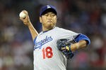 PHOENIX, AZ - JULY 16:  Starting pitcher Hiroki Kuroda #18 of the Los Angeles Dodgers pitches against the Arizona Diamondbacks during the Major League Baseball game at Chase Field on July 16, 2011 in Phoenix, Arizona.  (Photo by Christian Petersen/Getty Images)