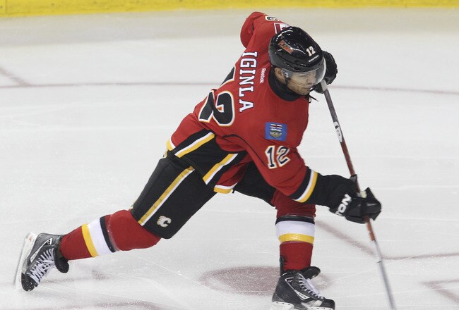 CALGARY, CANADA - JANUARY 07:  Jarome Iginla #12 of the Calgary Flames takes a slap shot against the Minnesota Wild during third period NHL action on January 7, 2012 at the Scotiabank Saddledome in Calgary, Alberta, Canada. (Photo by Mike Ridewood/Getty Images)