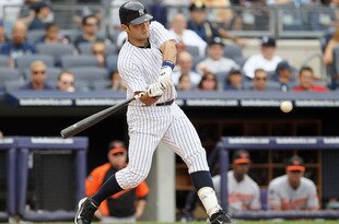 NEW YORK, NY - SEPTEMBER 05:  Jesus Montero #63 of the New York Yankees connects on a fifth inning home run against the Baltimore Orioles on September 5, 2011 at Yankee Stadium in the Bronx borough of New York City. The blast was the first in the major leagues for Montero. (Photo by Jim McIsaac/Getty Images)