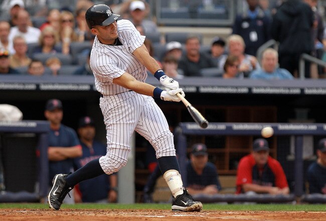 NEW YORK, NY - SEPTEMBER 24: Jesus Montero #63 of the New York Yankees hits an RBI single in the second inning against the Boston Red Sox on September 24, 2011 at Yankee Stadium in the Bronx borough of New York City.  (Photo by Nick Laham/Getty Images)