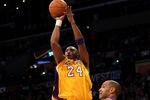 LOS ANGELES, CA - JANUARY 10:  Kobe Bryant #24 of the Los Angeles Lakers shoots over Grant Hill #33 of the Phoenix Suns at Staples Center on January 10, 2012 in Los Angeles, California. NOTE TO USER: User expressly acknowledges and agrees that, by downloading and or using this photograph, User is consenting to the terms and conditions of the Getty Images License Agreement.  (Photo by Stephen Dunn/Getty Images)