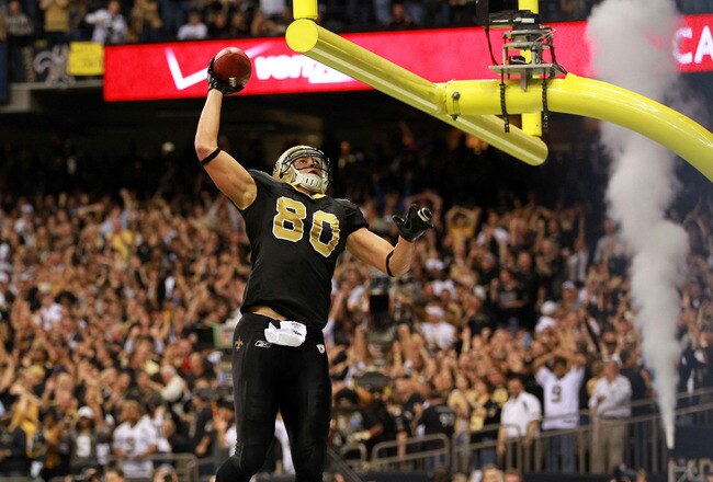 NEW ORLEANS, LA - JANUARY 07:   Jimmy Graham #80 of the New Orleans Saints celebrates by dunking the football over the crossbar after scoring a touchdown in the third quarter against the Detroit Lions during their 2012 NFC Wild Card Playoff game at Mercedes-Benz Superdome on January 7, 2012 in New Orleans, Louisiana.  (Photo by Ronald Martinez/Getty Images)