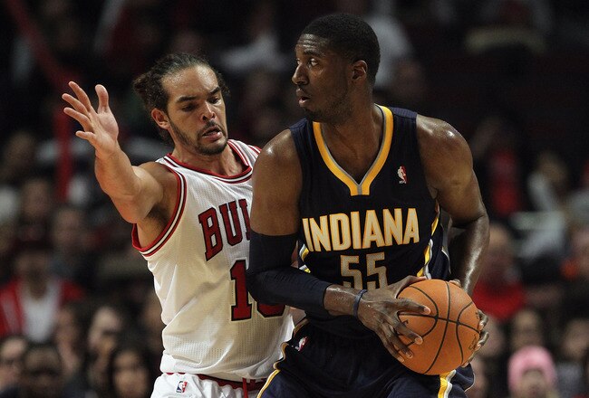 CHICAGO, IL - DECEMBER 20: Roy Hibbert #55 of the Indiana Pacers looks to pass under presure from Joakim Noah #13 of the Chicago Bulls at the United Center on December 20, 2011 in Chicago, Illinois. The Bulls defeated the Pacers 93-85. NOTE TO USER: User expressly acknowledges and agrees that, by downloading and or using this photograph, User is consenting to the terms and conditions of the Getty Images License Agreement. (Photo by Jonathan Daniel/Getty Images)