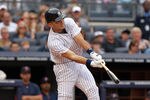 NEW YORK, NY - SEPTEMBER 24: Jesus Montero #63 of the New York Yankees hits an RBI single in the second inning against the Boston Red Sox on September 24, 2011 at Yankee Stadium in the Bronx borough of New York City.  (Photo by Nick Laham/Getty Images)