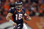 DENVER, CO - JANUARY 08:  Quarterback Tim Tebow #15 of the Denver Broncos carries the ball during the AFC Wild Card Playoff game against the Pittsburgh Steelers at Sports Authority Field at Mile High on January 8, 2012 in Denver, Colorado.  (Photo by Jeff Gross/Getty Images)