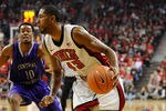 LAS VEGAS, NV - DECEMBER 28:  Mike Moser #43 of the UNLV Rebels drives against Mark Rutledge #10 of the Central Arkansas Bears during their game at the Thomas & Mack Center December 28, 2011 in Las Vegas, Nevada. UNLV won 124-75.  (Photo by Ethan Miller/Getty Images)