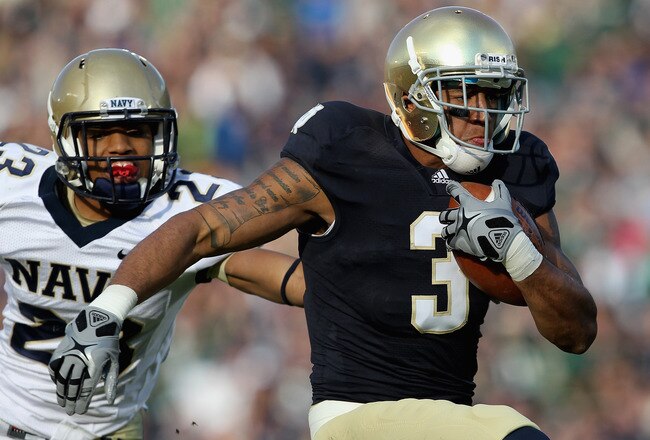 SOUTH BEND, IN - OCTOBER 29: Michael Floyd #3 of the Notre Dame Fighting Irish runs in front of Chris Ferguson #23 of the Navy Midshipmen on a 56 yard touchdown catch at Notre Dame Stadium on October 29, 2011 in South Bend, Indiana. (Photo by Jonathan Daniel/Getty Images)
